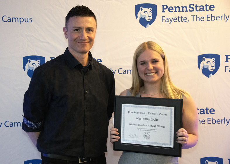 Aris Karagiorgakis, assistant teaching professor in psychology, with mentee Adriana Gebe, winner of the 2022 Student Excellence Award.