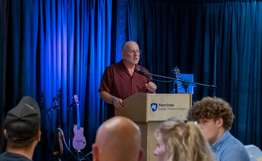 W. Charles Patrick delivering a speech after being recognized for his generosity.