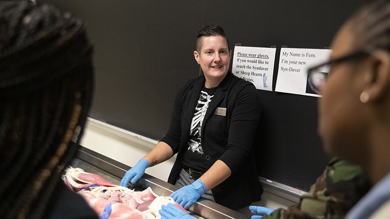 Katrina Porter, assistant teaching professor of biology, introduces the Syndaver, a simulated human cadaver used for study.