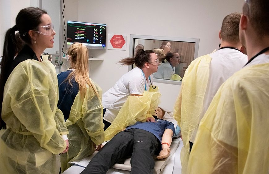 Students L-R  Morgan Dewitt, Jordan Pascoe, Caitlyn Stashick, Lucas Klorczyk, and Jonathan Klorczyk treat “Harry,” a simulated coded patient.