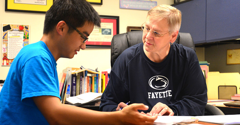 Jo Ann Jankoski conferences with a student.