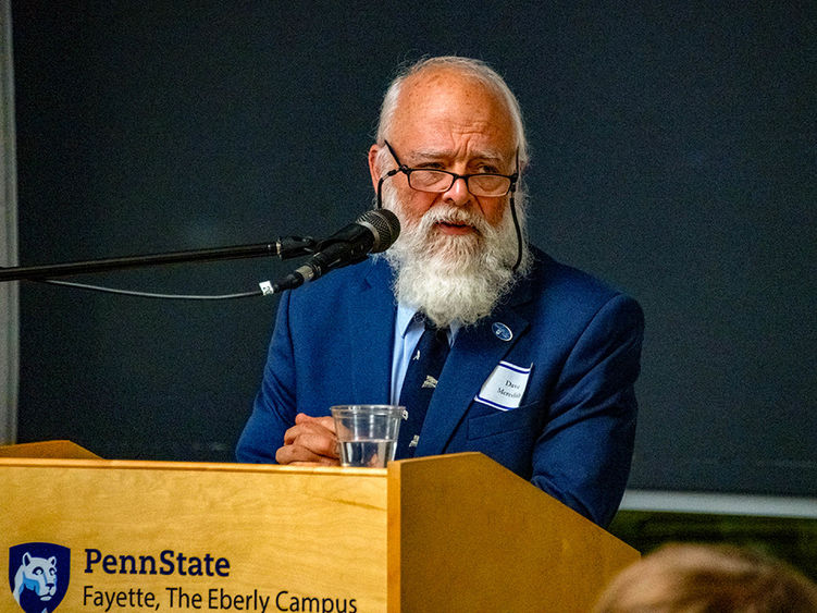 David B. Meredith speaking at the podium.