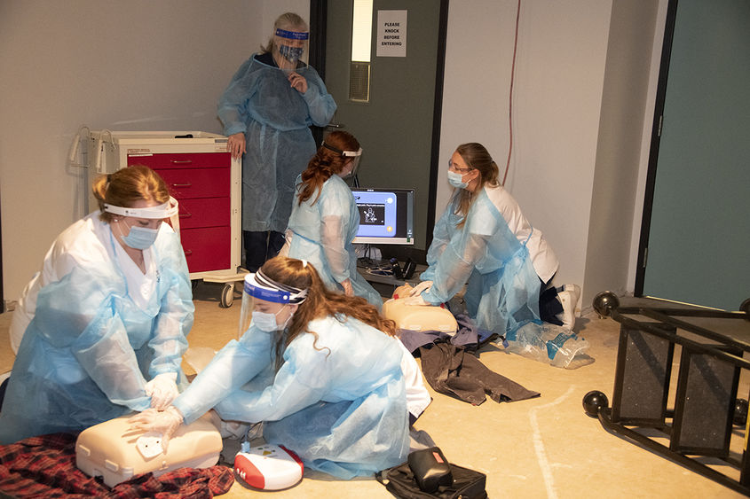 Four nursing students treat simulated patients in educational escape room