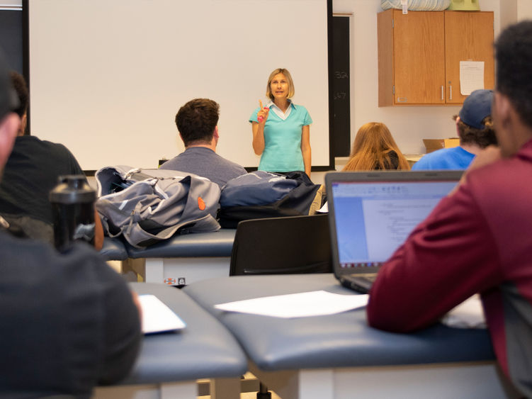 A Penn State professor giving a lecture to her students