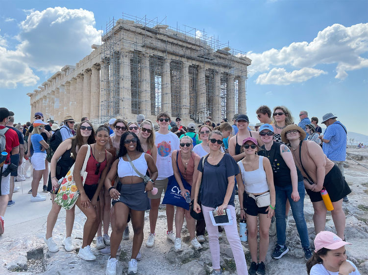 Students from Penn State pose in front of the Parthenon during their study abroad program in Athens, Greece.