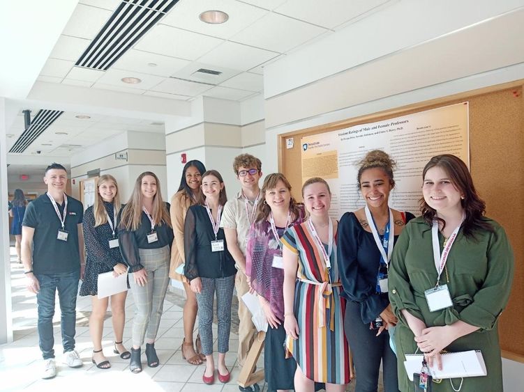 Aris Karagiorgakis, assistant teaching professor of psychology; students Ashley Stangroom, Kerstin Nutt, Pasepa Buwawa-Driso, Kenadi Erdely, and Tyler Miller; Elaine Barry, associate professor of human development and family studies; and students Adriana Gebe, Serenity Robinson, and Mary Byers.