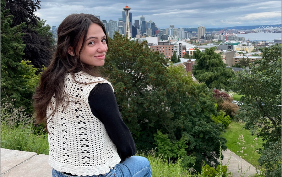 Josephine Pindro poses in front of the Seattle skyline.